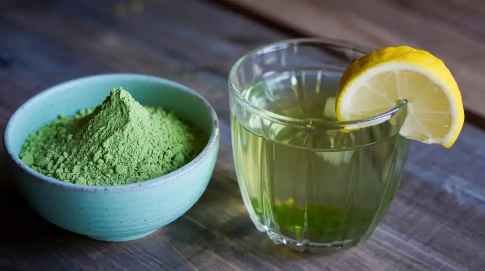 a cup and a glass with green tea and matcha