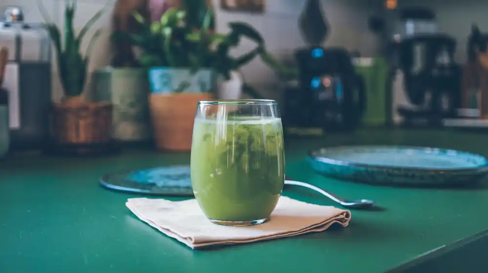 a glass of matcha green tea